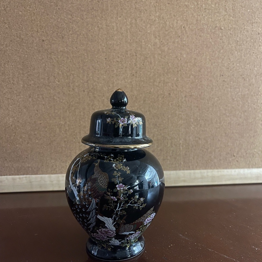 SOLD 


Black Ceramic Jar with Floral Design